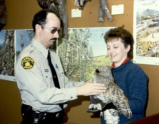 Man in uniform with women and owl